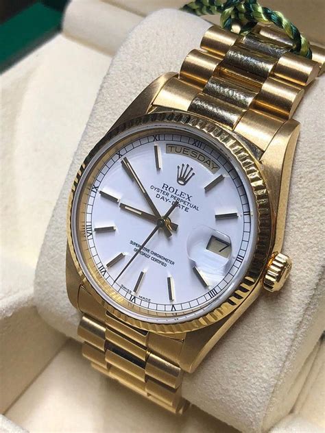 rolex presidential gold white face.